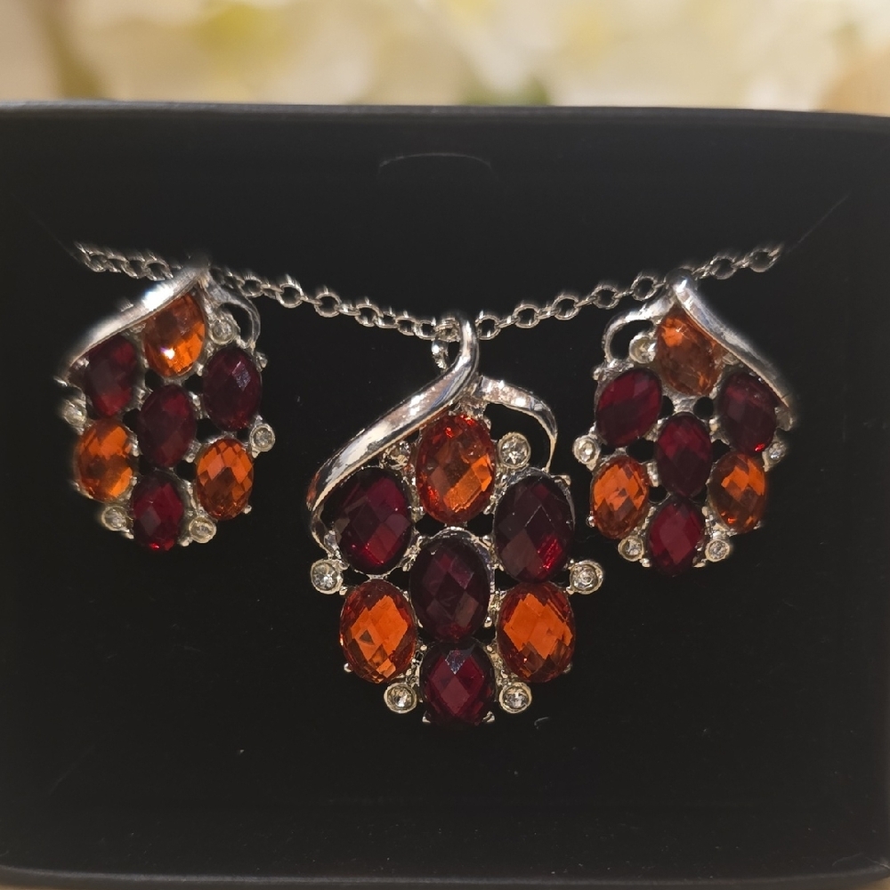 Elegant Silver Jewelry Set with Red and Orange Gems